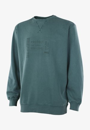 Grünes Sweatshirt mit Rundhalsausschnitt, gerippten Bündchen und Saum, mit einem verblassten Aufdruck mit dem Text „Schütze die Dinge, die du liebst“ und „Erkunde, um zu fahren.“