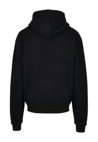 Schwarzer Kapuzenpullover mit einer großzügigen Kapuze, gerippten Bündchen und einem lockeren Schnitt. Hergestellt aus weichem Material mit einer glatten Textur.