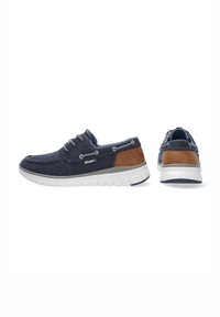 Navy Canvas Slipper mit braunen Akzenten, weißer Gummisohle und Metallösen. Verfügt über ein gepolstertes Innenleben für zusätzlichen Komfort.