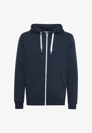 Marineblauwe zip-up hoodie van zacht stof, met een voorzak, witte trekkoorden en ribgebreide manchetten aan de uiteinden van de mouwen.
