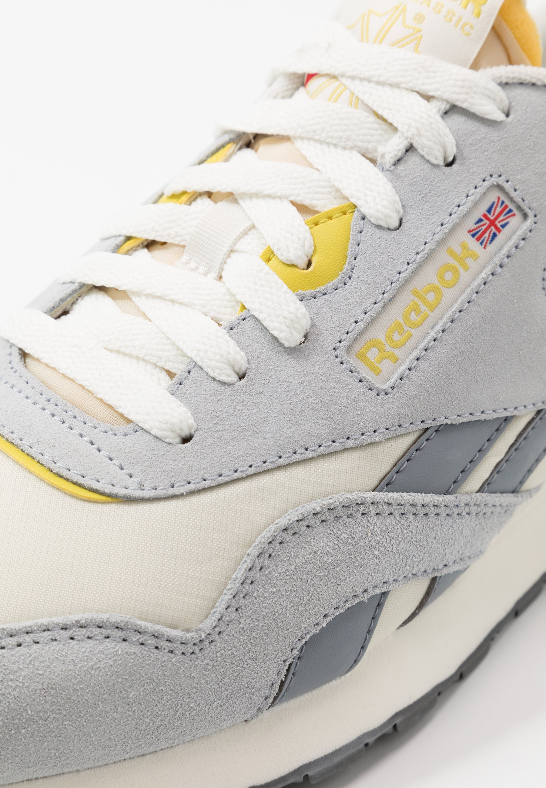 grey and yellow trainers