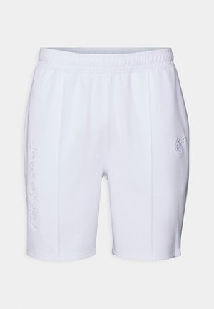 Shorts de sport blancs avec taille élastique, couture verticale détaillée, et texte brodé subtil sur la jambe gauche ainsi que logo sur la jambe droite.