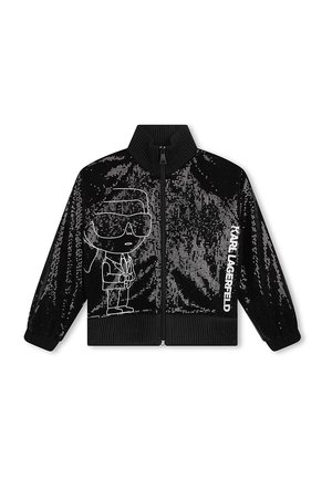 Giacca nera a zip con paillettes e colletto alto, con una grafica di cartone animato bianca e il testo "KARL LAGERFELD" sul lato.