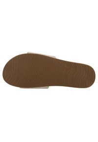 Semelle en caoutchouc brun avec une texture ondulée, dotée d'un attachement de bandoulière translucide. Le design est plat avec des bords arrondis.