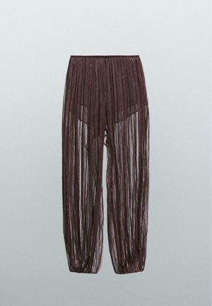 Braune, transparente, plissierte Hose mit lockerer Passform, elastischem Bund und leichtem, strukturiertem Stoff. Die Länge reicht bis zur Mitte der Waden.