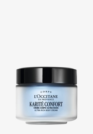 Rund mat glasbeholder med sort låg mærket L'Occitane Karité Confort Ultra Rich Body Cream på hvid baggrund.
