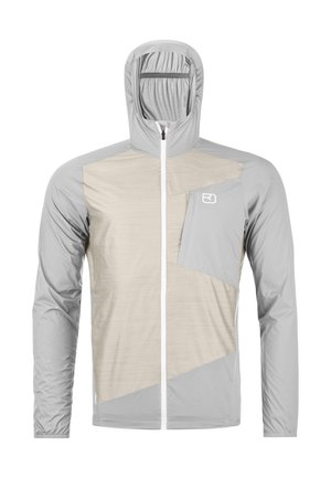 Hellgraue und beige Kapuzenjacke mit durchgehendem Reißverschluss und Brusttasche, die auf der rechten Seite ein kleines weißes Logo trägt.