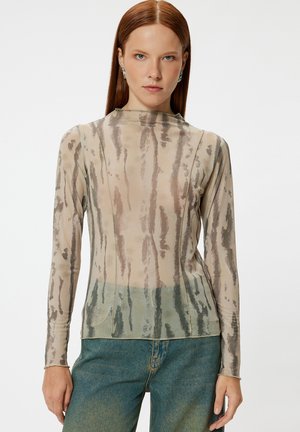 Transparante blouse met lange mouwen in beige, versierd met groene en bruine verticale strepen, met een hoge halslijn en een aansluitend ontwerp.