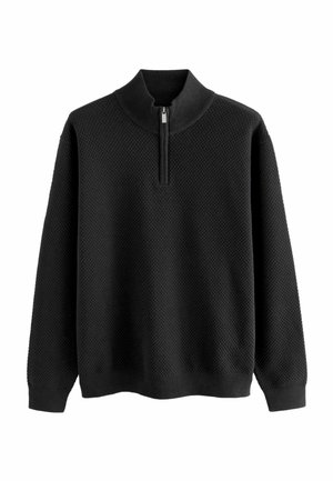 Black pullover sweater with a zip-up collar, waffle knit texture, and long sleeves; features ribbed cuffs and hem.