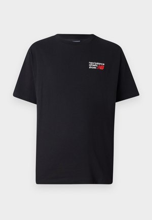 Black cotton t-shirt with a round neckline. Features a small red and white "New Balance" logo and text on the upper left chest area.