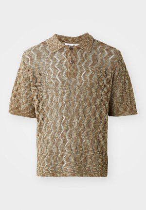 Short-sleeve polo shirt in a tan, textured knit with wavy patterns. Features a collar and one brown button at the neck.