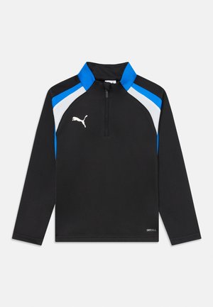 Pull-over athlétique noir à manches longues avec des accents bleus et blancs aux épaules, fermeture éclair quart, logo Puma sur la poitrine gauche, et texte "DRYCELL" près de l'ourlet.