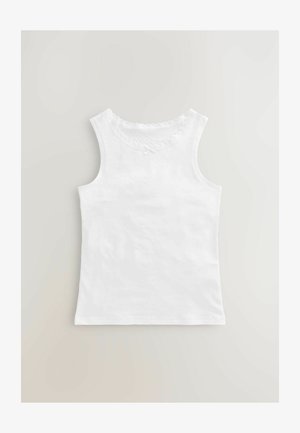 Top senza maniche bianco con scollatura a zig zag, un piccolo dettaglio a fiocco e una texture di cotone morbida.