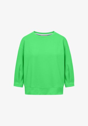 Jasnozielona bluza z długim rękawem i okrągłym dekoltem, o swobodnym kroju i szerokim obszyciu, prezentowana na jednolitym białym tle.