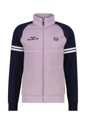 Veste de suivi zippée en violet clair et marine, avec un col haut, des accents de bande blanche et un logo brodé sur la poitrine.