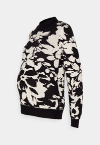 Svart och krämfärgad graviditetströja med blommönster, rund halsringning, långa ärmar och avslappnad passform, med ribbade manschetter och nederkant.