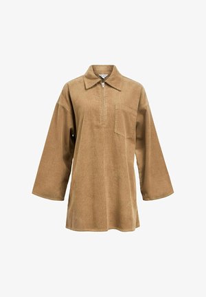 Pull-on en velours côtelé marron avec des manches larges, une fermeture éclair à l'avant, un col et une poche poitrine.