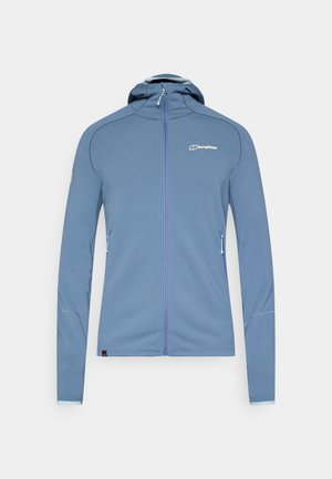 Lys blå hettejakke med glidelås laget av mykt stoff, med hette, lange ermer, glidelåslommer på siden og logo på øvre høyre bryst.