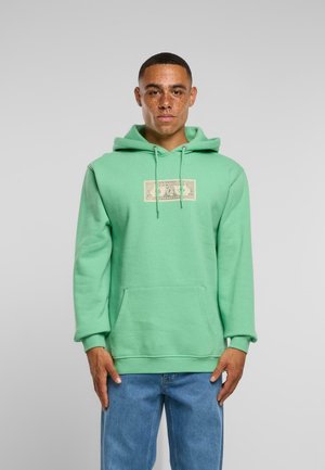 Green hoodie made of soft cotton, featuring a front pocket and a graphic design on the chest. Long sleeves and adjustable drawstring hood.