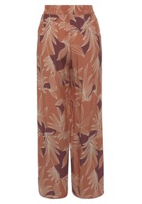 Uitlopende broek in terracotta met een lichte bloemenprint. Gemaakt van zachte, ademende stof. Voorzien van een elastische taille voor comfort.