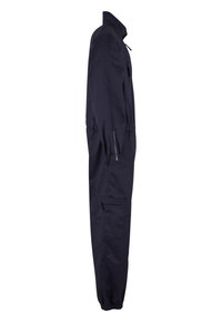 Combinaison bleu marine une pièce avec manches longues, poignets élastiqués et multiples poches zippées, vue de profil sur fond blanc.