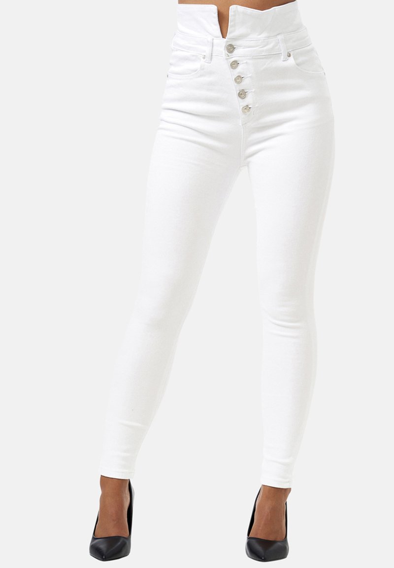 Jeans skinny blancos de cintura alta con cierre de botones en la parte delantera, hechos de denim elástico, con una textura suave y un ajuste entallado.
