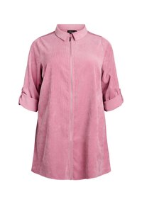 Roosa kordanüüdiga jakk terava kraega, lukuga ees ja üles keritud varrukatega. Pehme tekstuur ja mugav lõige.