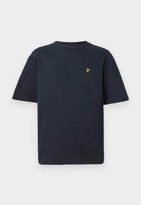T-shirt en coton bleu marine à manches courtes et col rond, arborant un petit emblème d'aigle jaune sur la poitrine gauche.