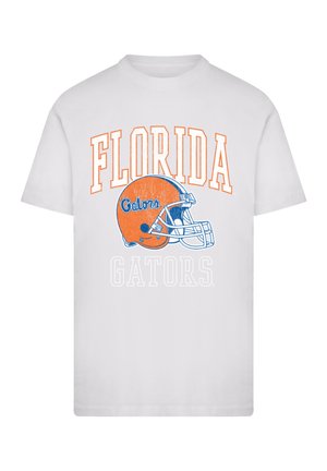 Weißes T-Shirt mit dem Text "FLORIDA" und "GATORS" in Orange und Blau, über dem Text ist ein oranges Football-Helm-Design zentriert.