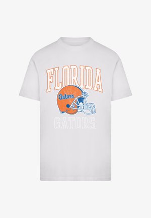 Weißes T-Shirt mit dem Text "FLORIDA" und "GATORS" in Orange und Blau, über dem Text ist ein oranges Football-Helm-Design zentriert.