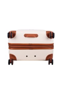 Hard-shell suitcase in cream with brown accents, featuring smooth wheels, a top handle, and a zipper closure with two fastening points.