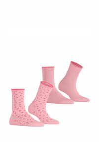 Rosa Socken Set mit zwei einfarbigen Paaren und einem Paar mit einem gepunkteten Muster. Weicher Stoff mit kontrastierenden rosa Bündchen.