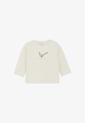 Camisa de algodón crema de manga larga con una ilustración de un pájaro azul en el frontal. Cuello redondo simple, textura suave y sin cierres visibles.