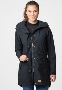 Black hooded jacket with a zip front, snap closures, and side pockets. Features a textured fabric and a branded patch on the hem.