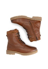 Bottines en cuir marron à lacets avec des fermetures éclair sur le côté et des semelles en caoutchouc, présentées en vues latérales et de dessus sur un fond blanc.
