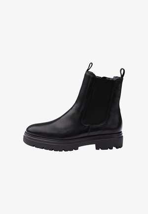 Black leather Chelsea boot with elastic side panel, pull tabs at top, thick lug sole, and smooth rounded toe.