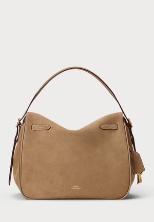 Suede beige handbag with a curved silhouette, top handle, and gold-tone hardware. Features a small tag and stitched accents.