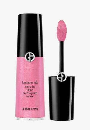 Giorgio Armani luminous silk cheek tint in a pink pearlescent tube with a black cap, featuring a wedge applicator and silver logo detail.