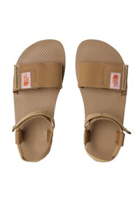 Ruske sandaali, joissa on teksturoitu kumipohja. Varustettu säädettävillä hihnoilla ja The North Face -logolla sivussa. Litteä muotoilu, jossa on avonaiset varpaat.