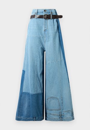 Wide-leg patchwork denim pants in varied blue shades with high waist and dark brown belt against white background.