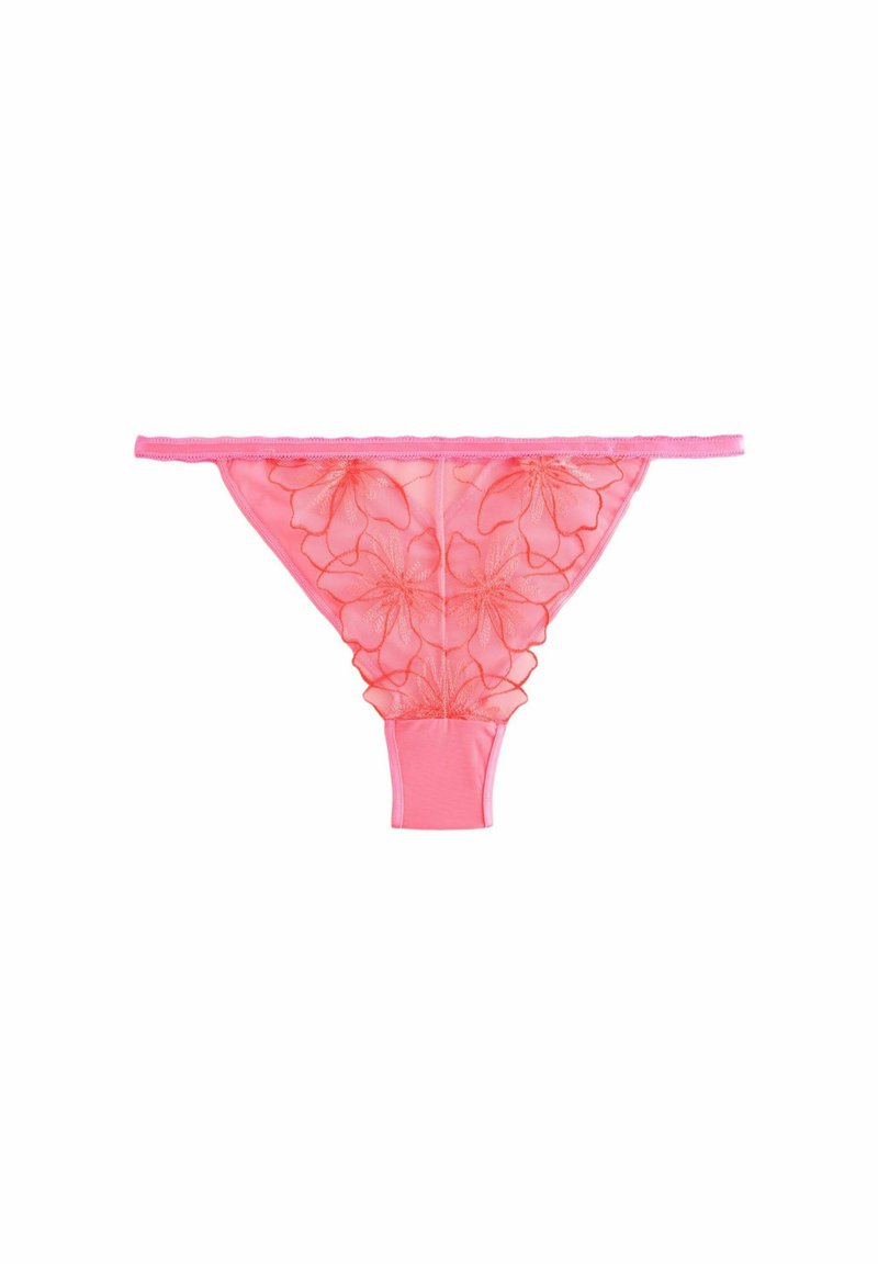 Pink sheer thong with floral embroidery, featuring a scalloped elastic waistband and a seamless fit. Smooth fabric texture and delicate design.