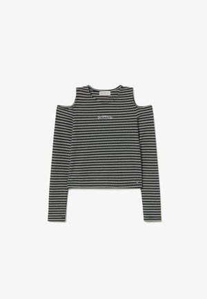 Haut à manches longues rayé noir et blanc avec découpes aux épaules et col arrondi. Présente un logo sur la poitrine et un design court.