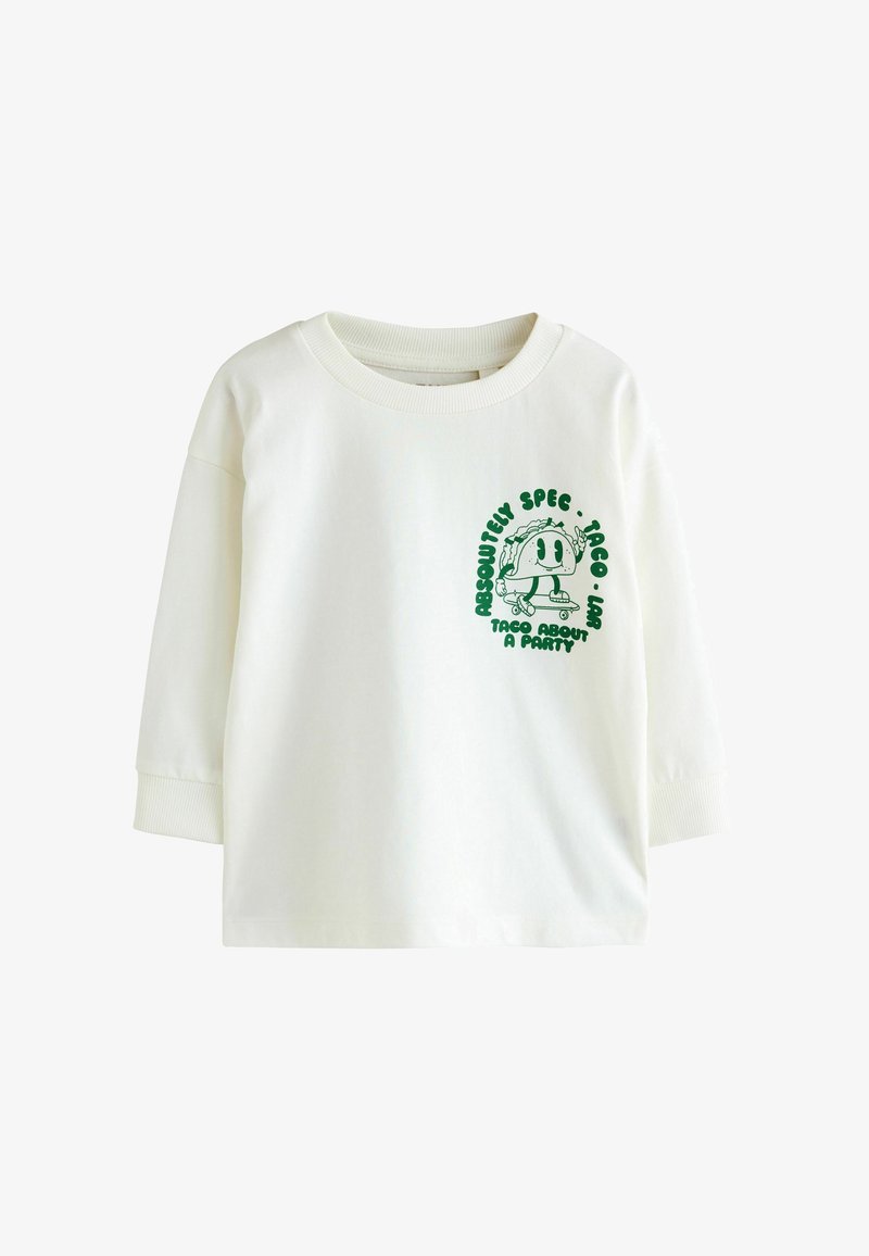 Tricou alb cu mânecă lungă, prezentând o grafică verde cu un personaj taco pe o placă de skateboard, cu textul 'Absolut Spec-Taco-Lar' deasupra și dedesubt.