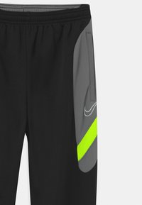 Nike Performance DRY ACADEMY - Pantalones deportivos - black/dark smoke grey/volt/light smoke grey