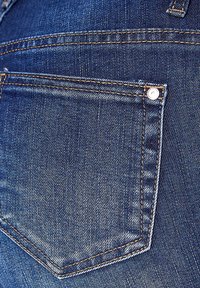 Denim jeans with a close-up view of the back pocket. Features dark blue color, double-stitching, and a metal button detail.