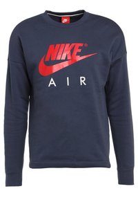 Námořnická modrá mikina vyrobená z bavlněné směsové tkaniny, s velkým červeným logem Nike a nápisem "AIR" ve bílé barvě, s kulatým výstřihem a dlouhými rukávy.