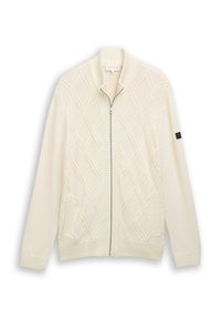 Strickjacke in Creme mit Rautenmuster, geripptem Kragen, Ärmelsäumen und Saum, ausgestattet mit silbernem Reißverschluss und zwei Fronttaschen.