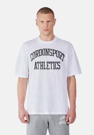 White short-sleeve cotton t-shirt featuring black printed text "CORDONSPORT ATHLETICS" in a bold, arched design across the chest.