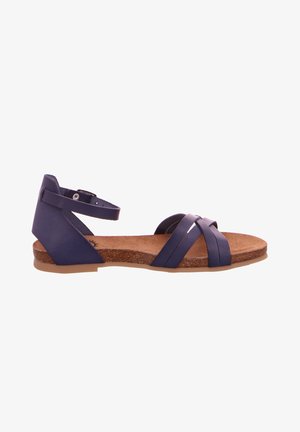 Marineblauwe sandalen met kurken voetbed, voorzien van kruissluitingen en een verstelbare enkelriem. Platte rubberen zool voor comfort en stabiliteit.