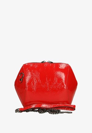 Red patent leather handbag with a hexagonal shape, featuring a zipper closure and a chain strap. Smooth texture with shiny finish.